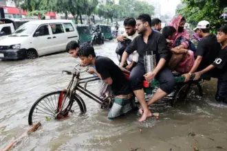 Bangladesh floods leaving streets and homes submerged after heavy rainfall