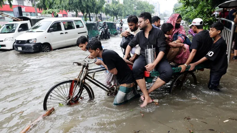 Bangladesh floods leaving streets and homes submerged after heavy rainfall