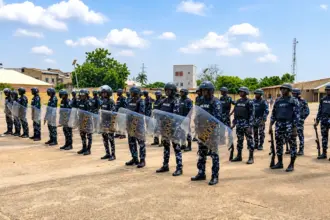 Kano police officers displaying combat skills during their passing-out ceremony in Hotoro