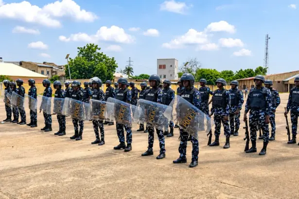 Kano police officers displaying combat skills during their passing-out ceremony in Hotoro