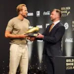 Bayern Munich striker Harry Kane holding his second European Golden Shoe in Munich
