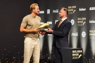 Bayern Munich striker Harry Kane holding his second European Golden Shoe in Munich