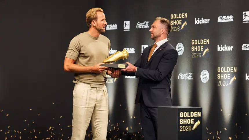 Bayern Munich striker Harry Kane holding his second European Golden Shoe in Munich
