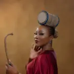 Cultural entertainer Abike Ilu wearing her signature talking drum-inspired hairstyle