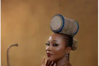 Cultural entertainer Abike Ilu wearing her signature talking drum-inspired hairstyle