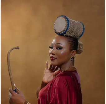 Cultural entertainer Abike Ilu wearing her signature talking drum-inspired hairstyle
