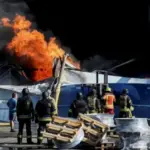 Smoke rising after a Russian drone strike on a weapons depot near Kyiv