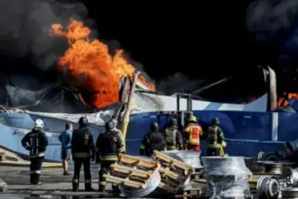 Smoke rising after a Russian drone strike on a weapons depot near Kyiv