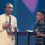 Pastor Jerry Eze and gospel singer Nathaniel Bassey after the car gift