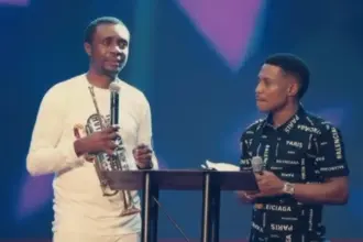 Pastor Jerry Eze and gospel singer Nathaniel Bassey after the car gift