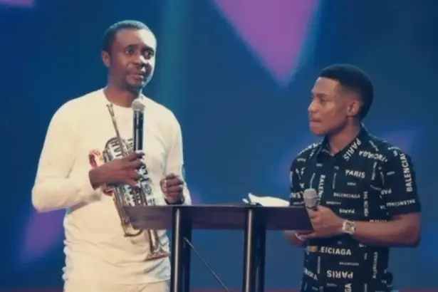 Pastor Jerry Eze and gospel singer Nathaniel Bassey after the car gift