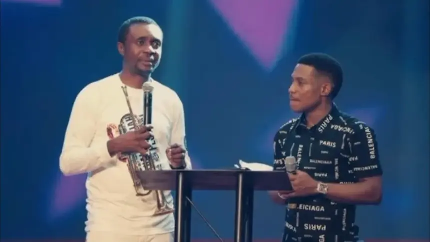 Pastor Jerry Eze and gospel singer Nathaniel Bassey after the car gift