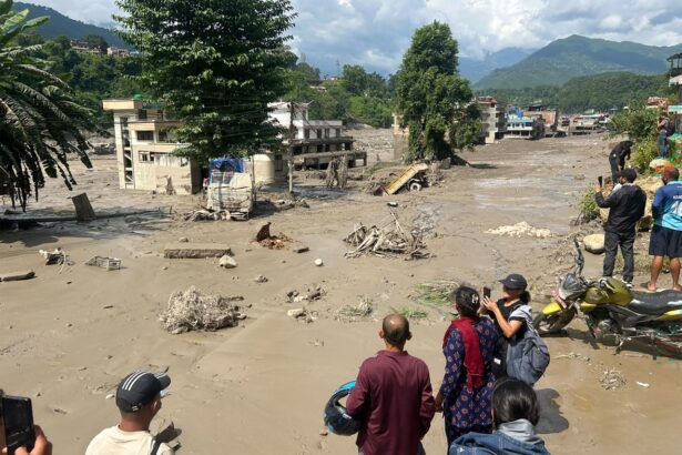 Devastation caused by flash floods in Nepal as rescue teams search for hundreds of missing people
