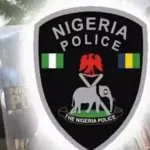 Enugu police displaying vehicle batteries and other items allegedly recovered from a theft suspect