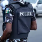 Abia State Police officers following the arrest of a suspected child trafficker and rescue of six children