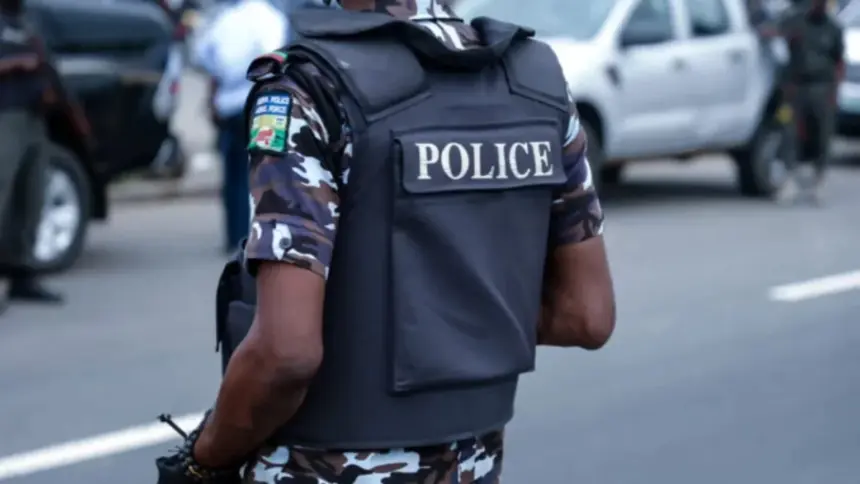 Abia State Police officers following the arrest of a suspected child trafficker and rescue of six children