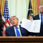 President Donald Trump signs an order changing US childhood vaccine recommendations