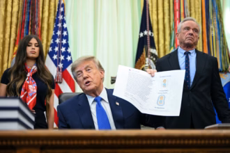 President Donald Trump signs an order changing US childhood vaccine recommendations