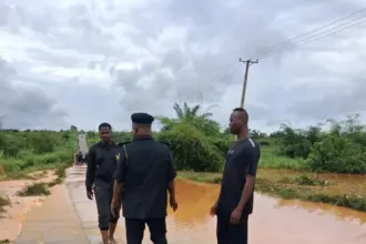 Flooded road in Anambra as police issue safety alert to parents