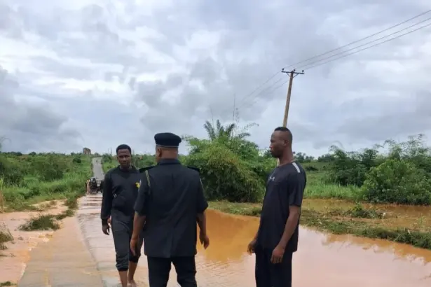 Flooded road in Anambra as police issue safety alert to parents