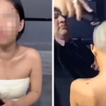 Woman holding her shaved hair after dispute over an unpaid bar bill in Bangkok