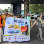 Visually impaired persons and volunteers participate in an awareness walk in Lagos to commemorate International White Cane Safety Day.